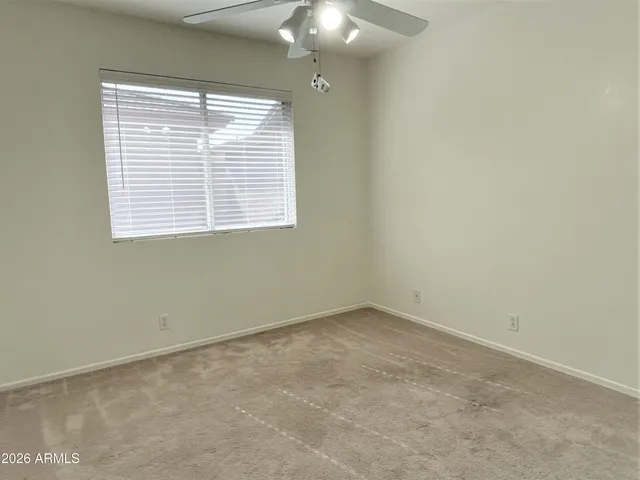 an empty room with a mirror