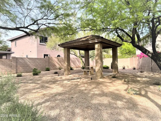 a view of a swimming pool with an outdoor seating