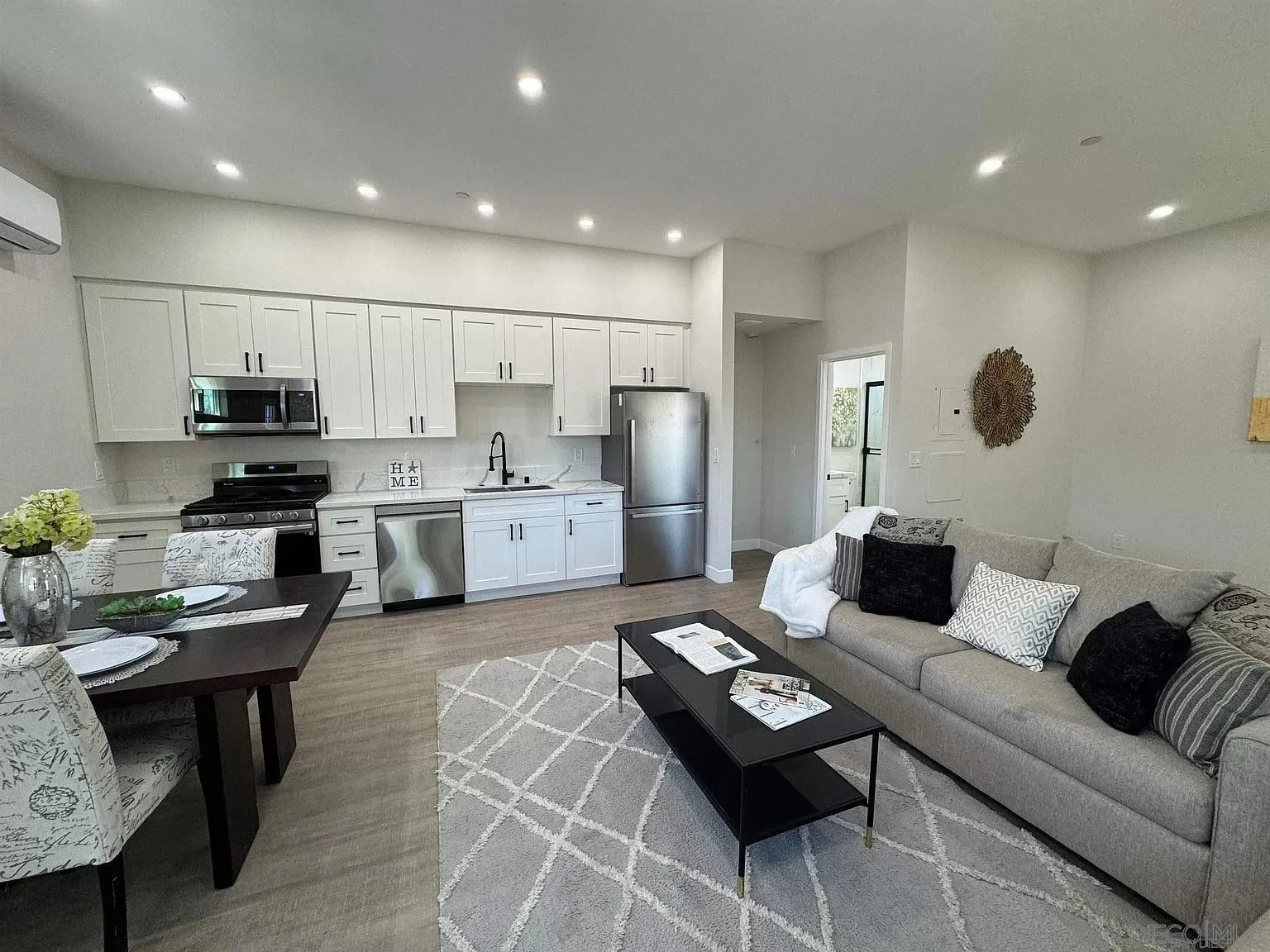 1064 11th Street, Unit 2 Imperial Beach, CA 91932 - Photo 1 of 10 a living room with furniture and kitchen view