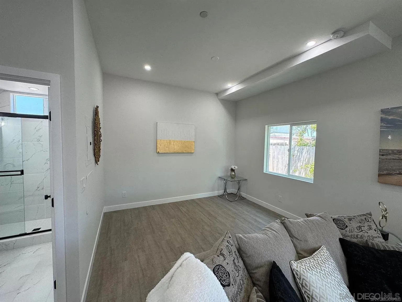 1064 11th Street, Unit 2 Imperial Beach, CA 91932 - Photo 5 of 10 a bedroom with a bed and a window