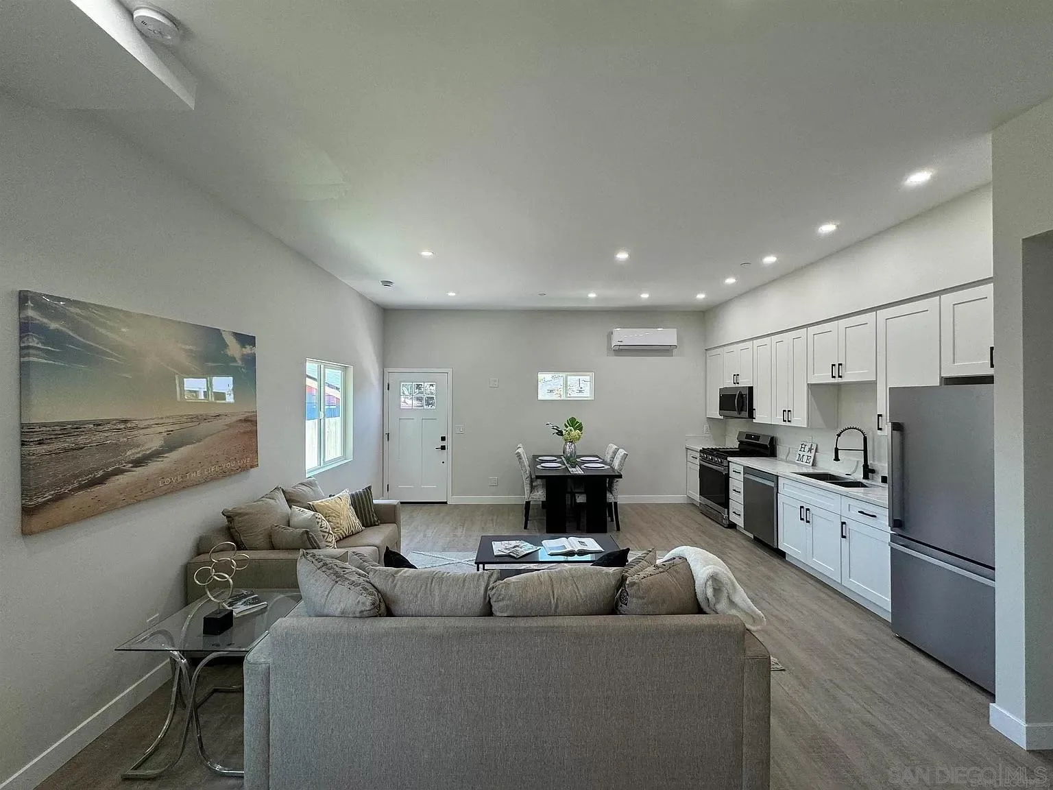 1064 11th Street, Unit 2 Imperial Beach, CA 91932 - Photo 7 of 10 a living room with furniture and a flat screen tv