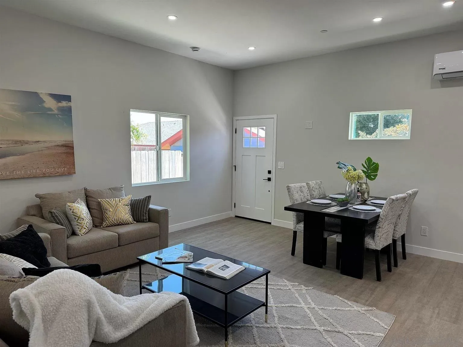 1064 11th Street, Unit 2 Imperial Beach, CA 91932 - Photo 8 of 10 a living room with furniture a rug and a window