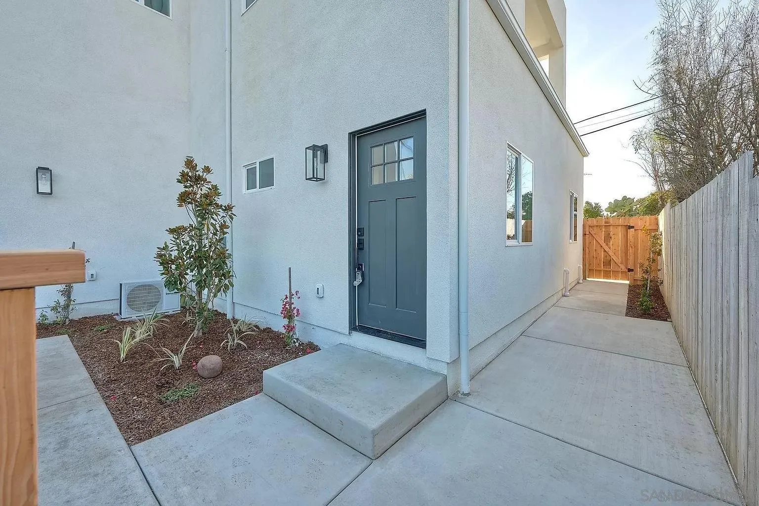 1064 11th Street, Unit 2 Imperial Beach, CA 91932 - Photo 9 of 10 a living room with a couch and potted plant