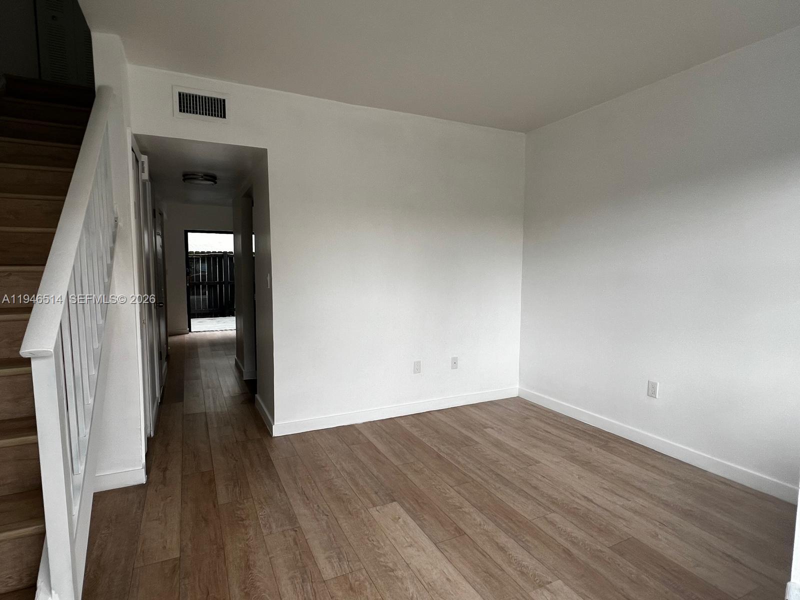 324 West 74th Place, Unit 6 Hialeah, FL 33014 - Photo 8 of 13 wooden floor in a hall with an entryway