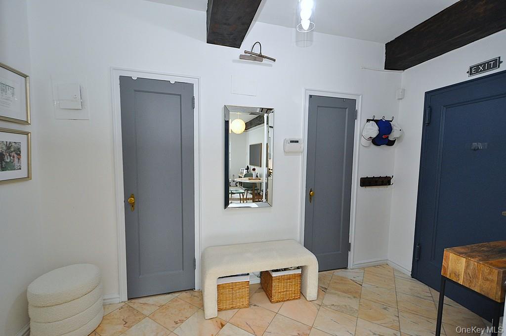 192 Garth Road, Unit TP Scarsdale, NY 10583 - Photo 30 of 43 A stunning marble-floored entry welcomes you into a light-filled home featuring charming courtyard views, soaring wood-beamed ceilings, gleaming hardwood floors, and an impressive eight oversized closets for exceptional storage.