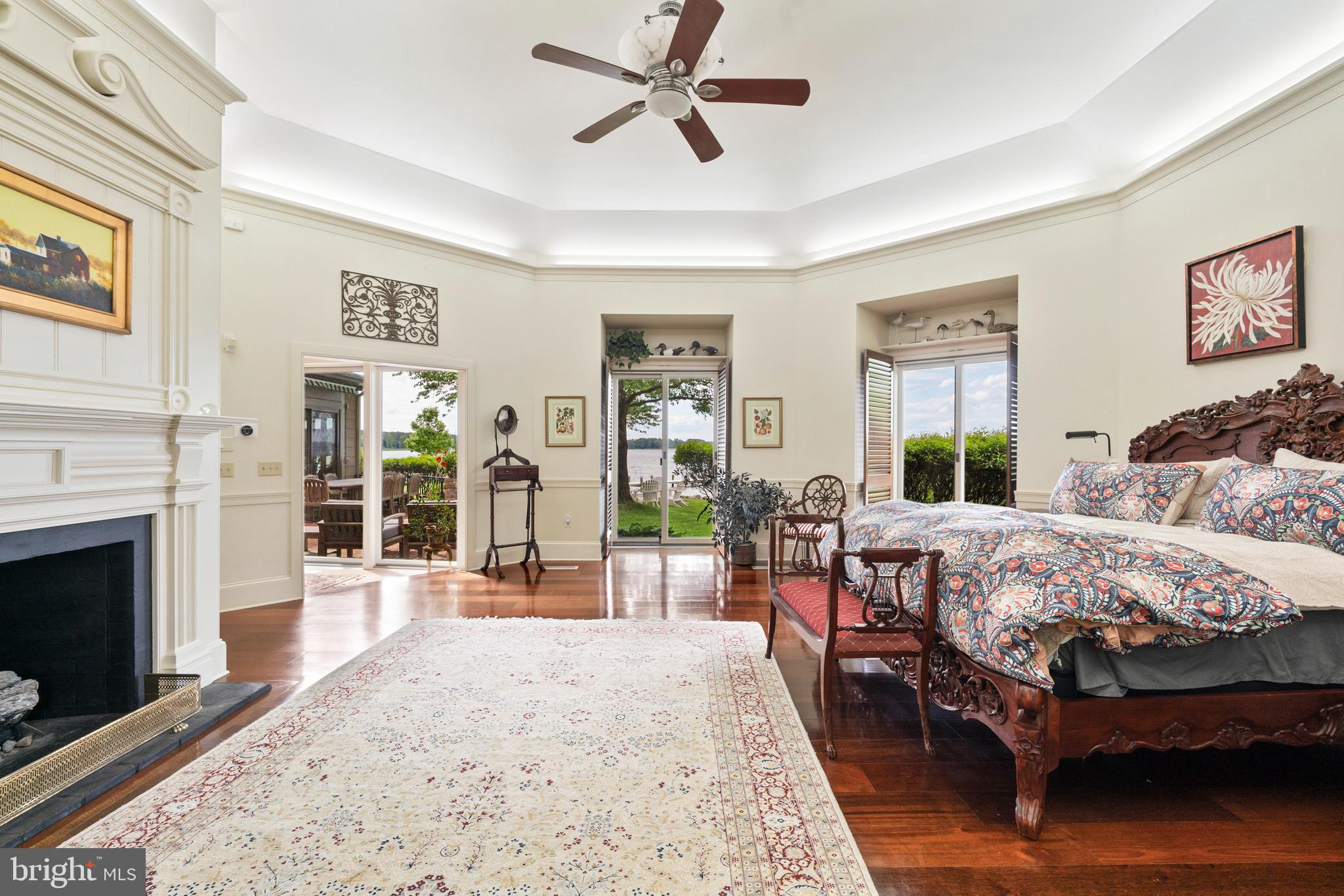 9791 Pintail Place St. Michaels, MD 21663 - Photo 22 of 80 a bedroom with a bed wooden floor and window