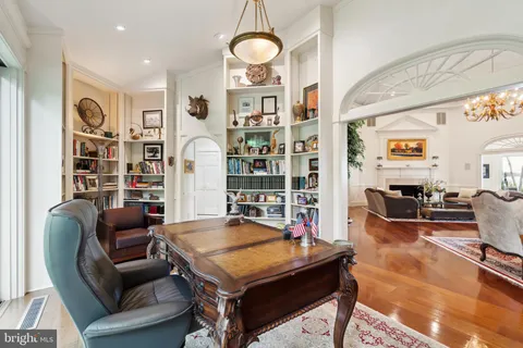 a kitchen with a table chairs and a lots of counter top space