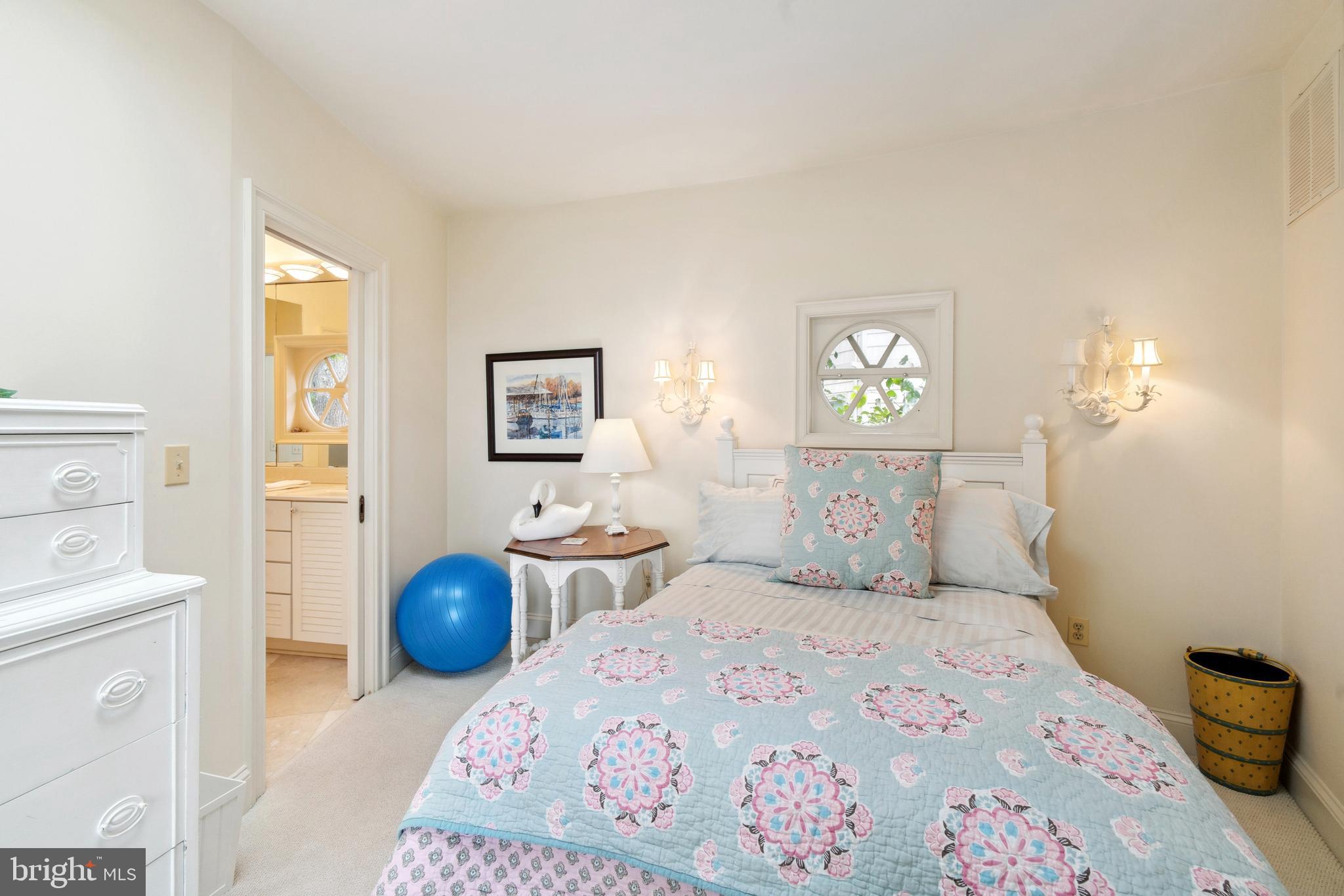 9791 Pintail Place St. Michaels, MD 21663 - Photo 33 of 80 a bedroom with a bed and wooden floor