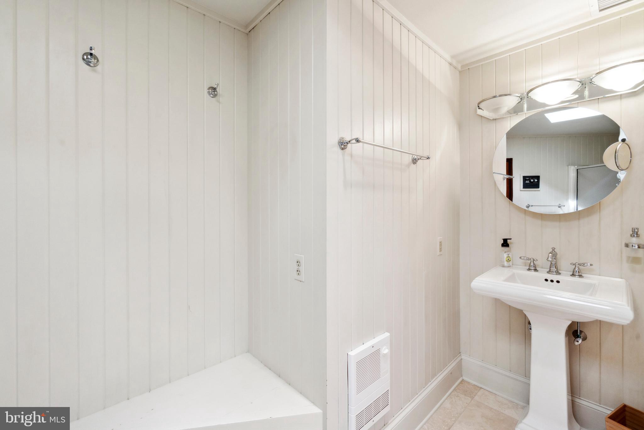 9791 Pintail Place St. Michaels, MD 21663 - Photo 36 of 80 a bathroom with a sink a toilet and shower