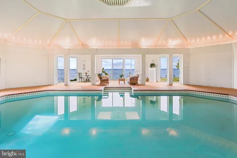 a backyard of a house with a yard and outdoor seating