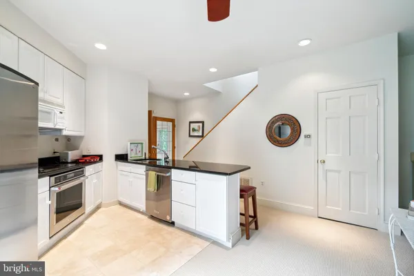 an aerial view of a houses with a lake