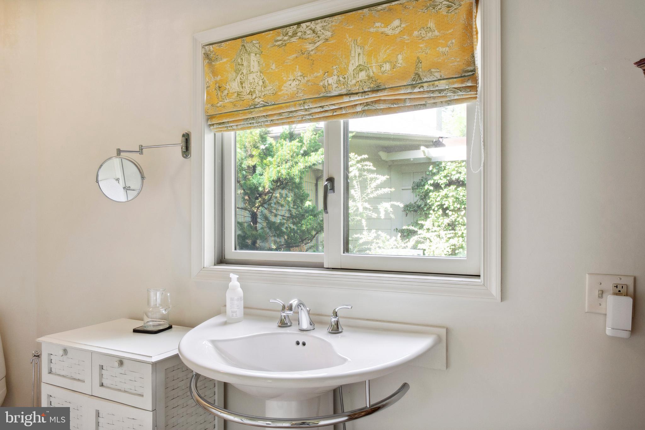 9791 Pintail Place St. Michaels, MD 21663 - Photo 54 of 80 a bathroom with a sink and a window