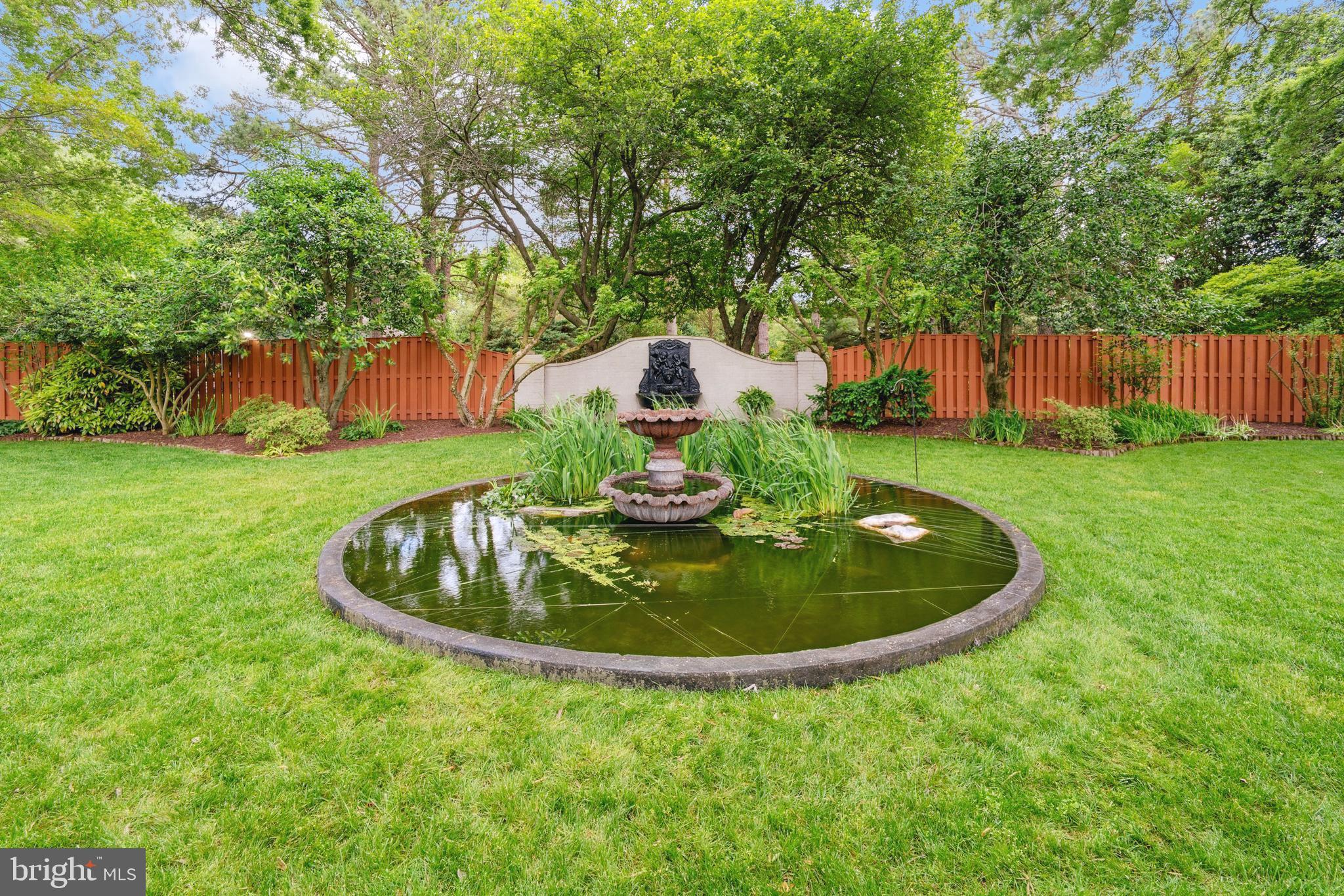 9791 Pintail Place St. Michaels, MD 21663 - Photo 57 of 80 a backyard of a house with a yard and outdoor seating