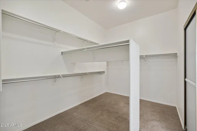 a view of an empty walk in closet
