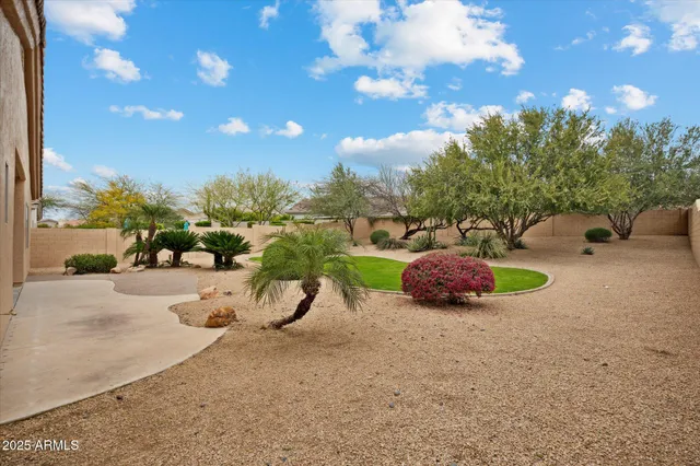 a view of a backyard with sitting area