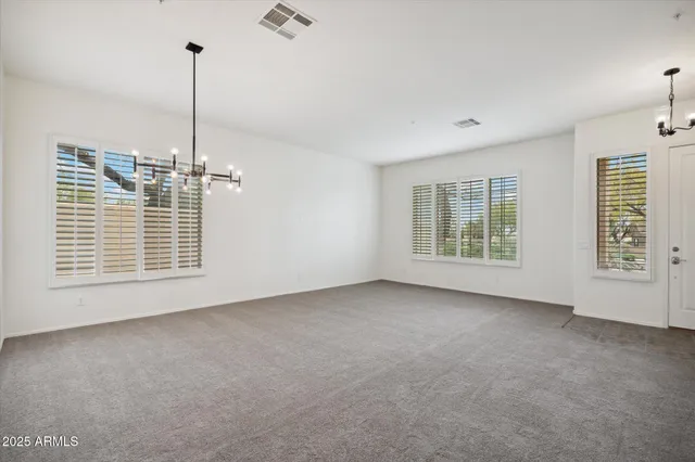 a view of an empty room with windows