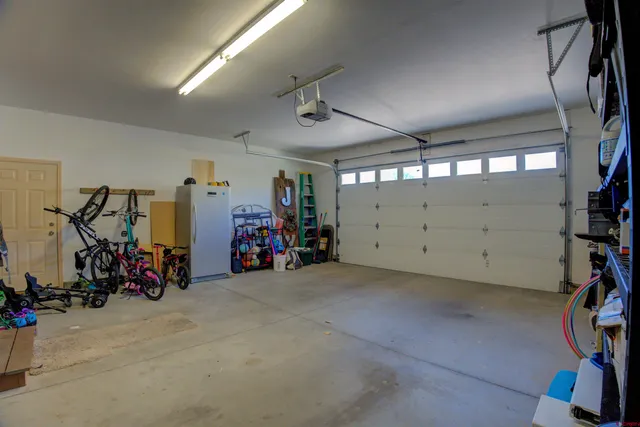 a view of walk in closet with clothes