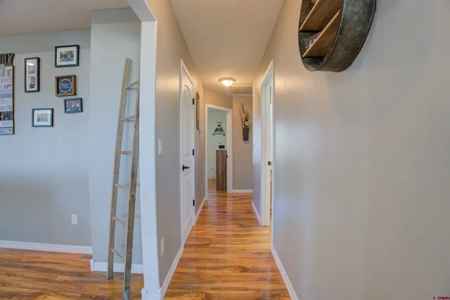 a bathroom with a granite countertop sink toilet and a mirror