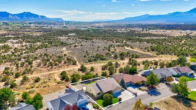 an aerial view of residential house and outdoor space