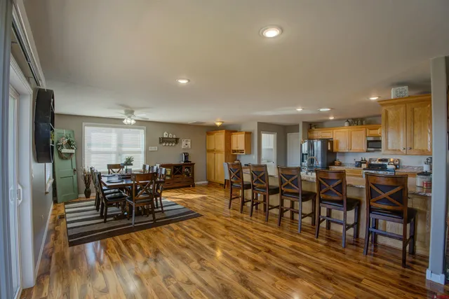 a view of a dining room with furniture window and wooden floor