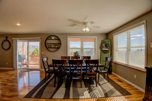 a view of a dining room with furniture window and wooden floor