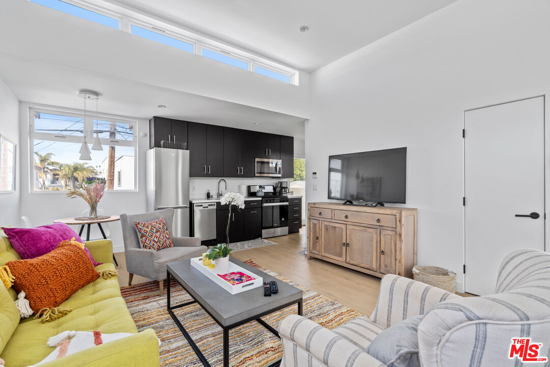 823 Flower Avenue Venice, CA 90291 - Photo 1 of 17 a living room with furniture kitchen view and a flat screen tv