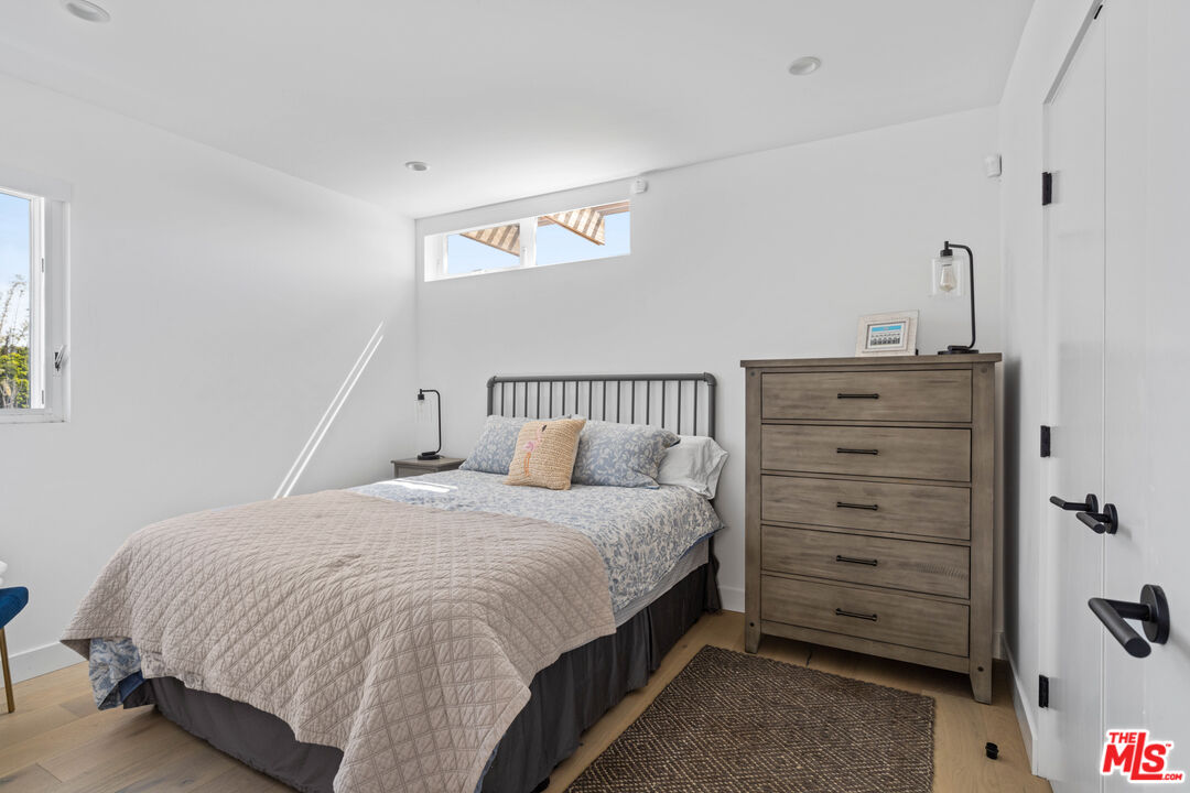 823 Flower Avenue Venice, CA 90291 - Photo 12 of 17 a bedroom with a bed and a dresser