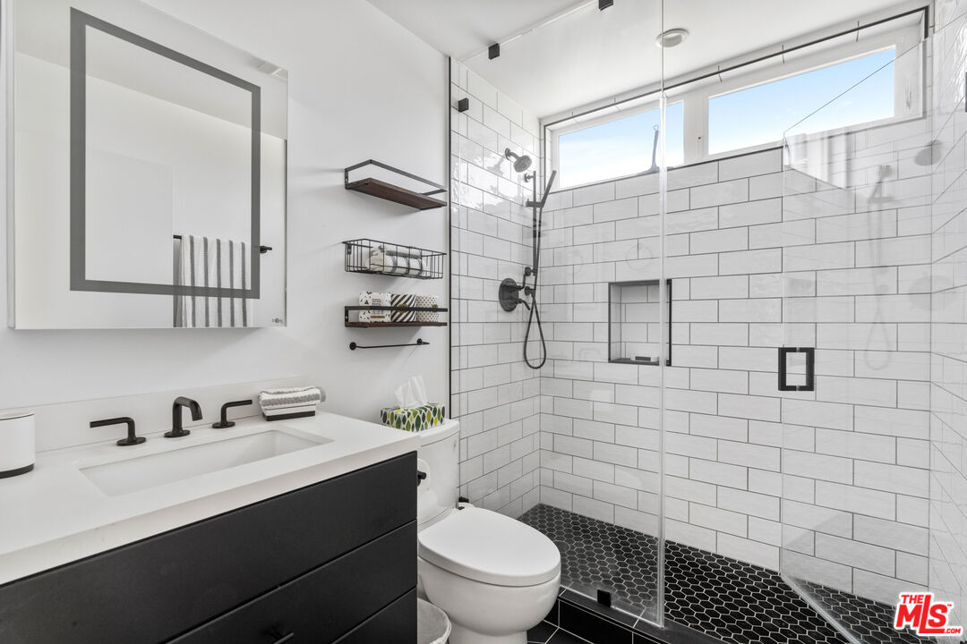 823 Flower Avenue Venice, CA 90291 - Photo 14 of 17 a bathroom with a sink a toilet and shower