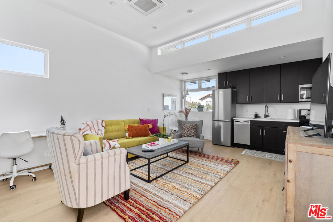 823 Flower Avenue Venice, CA 90291 - Photo 3 of 17 a living room with furniture and a wooden floor