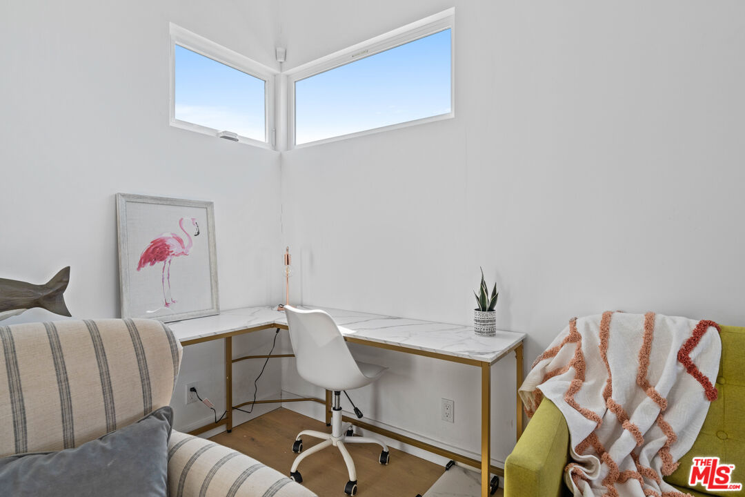823 Flower Avenue Venice, CA 90291 - Photo 6 of 17 a work room with furniture and a wooden floor