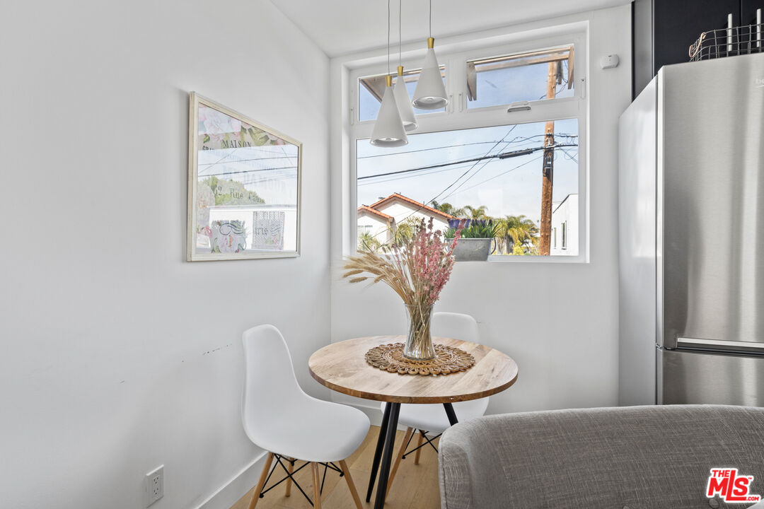 823 Flower Avenue Venice, CA 90291 - Photo 7 of 17 a view of a dining room with furniture window and wooden floor