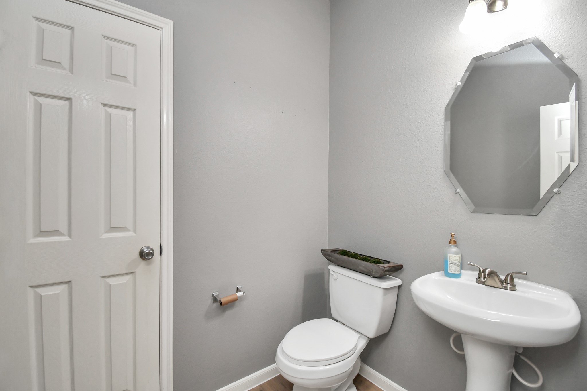 2808 Tranquility Trail Pearland, TX 77584 - Photo 14 of 30 a bathroom with a toilet sink and mirror