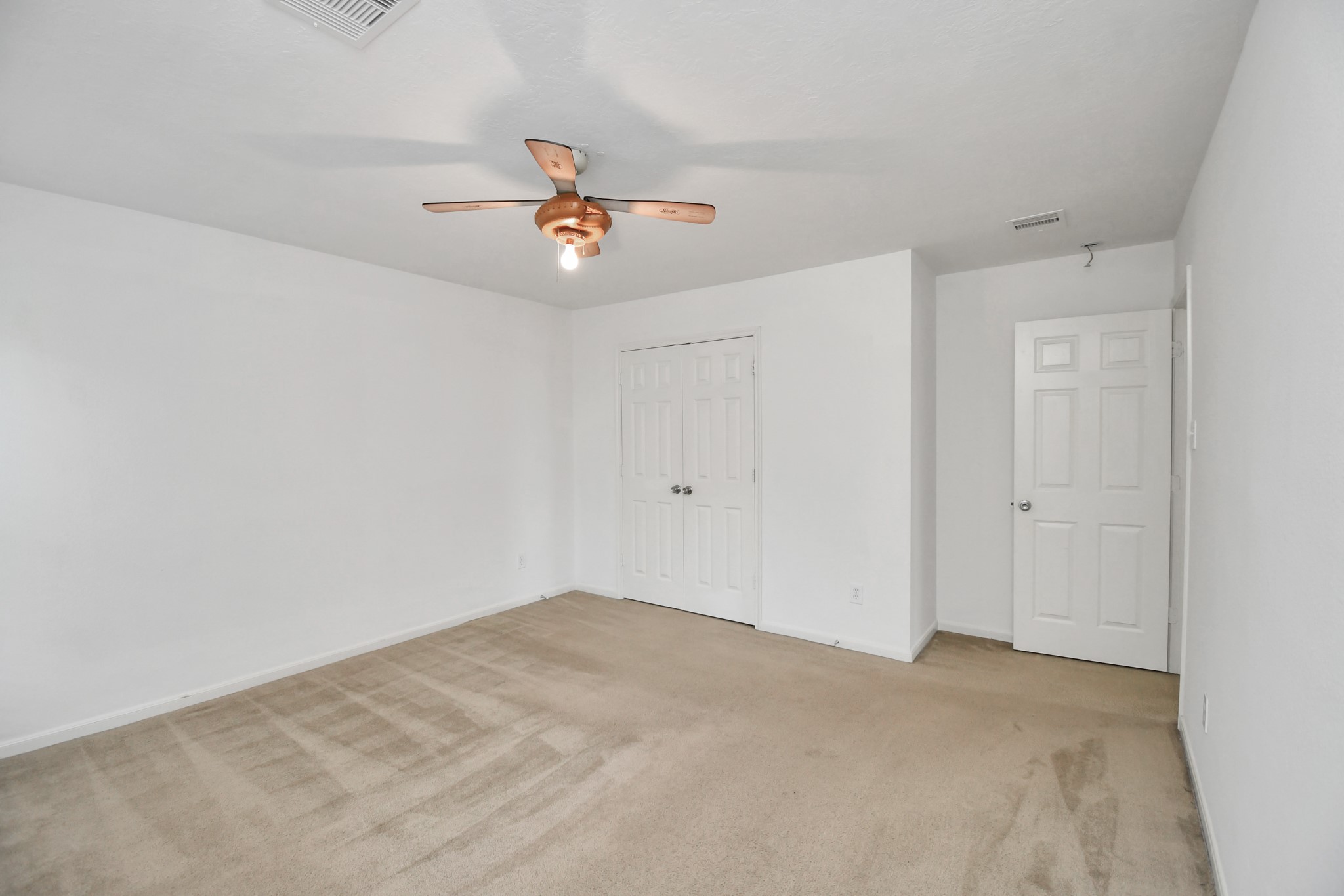 2808 Tranquility Trail Pearland, TX 77584 - Photo 20 of 30 a view of a room with a ceiling fan and window