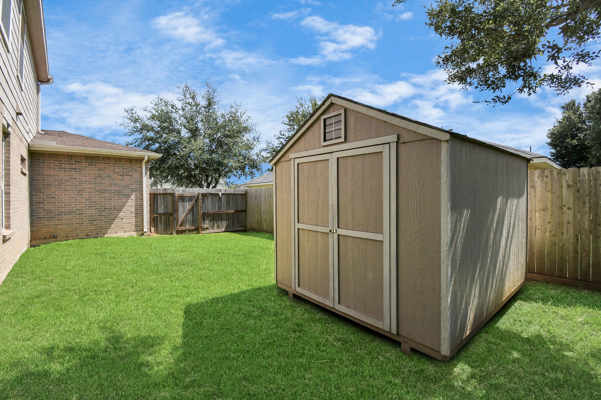 2808 Tranquility Trail Pearland, TX 77584 - Photo 27 of 30 a front view of a house with garden