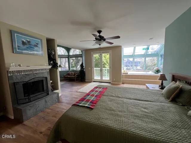 a bedroom with furniture and a fireplace