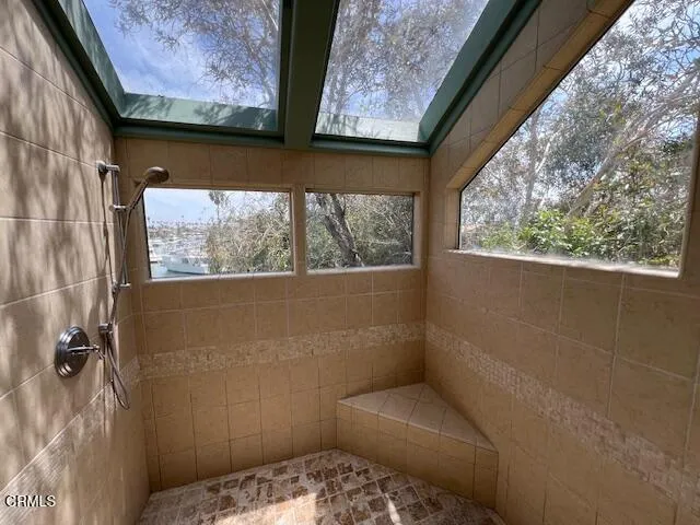 a bathroom with a toilet and a window