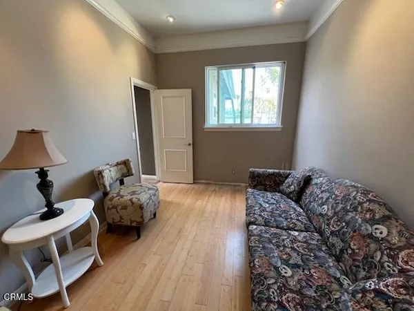 a bedroom with bed and a window