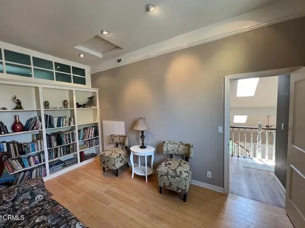 a bed room with bed and a book shelf