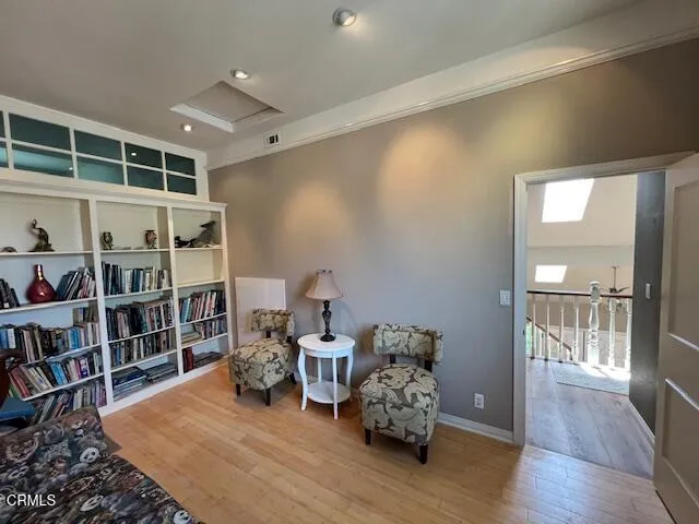 a bed room with bed and a book shelf