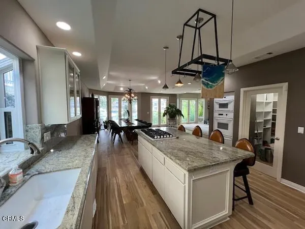 a view of a living room and kitchen