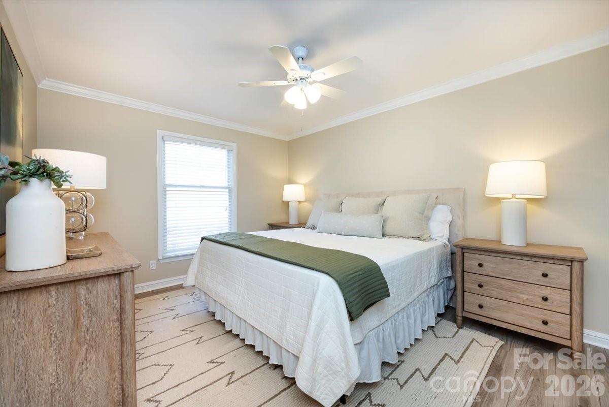 430 Queens Road, Unit 221 Charlotte, NC 28207 - Photo 13 of 21 a bedroom with a bed and window