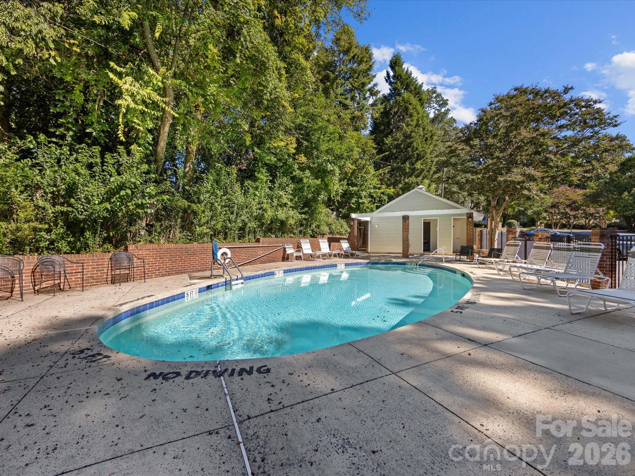 430 Queens Road, Unit 221 Charlotte, NC 28207 - Photo 21 of 21 a view of a house with a yard