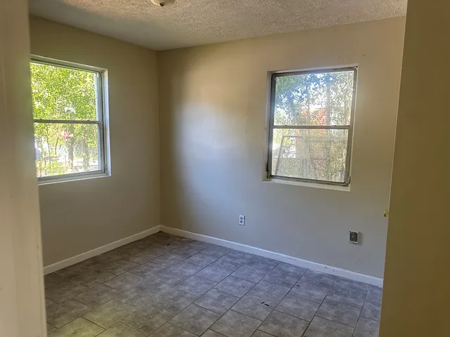 an empty room with windows