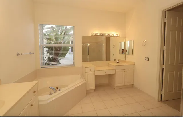 a bathroom with a bathtub and a shower