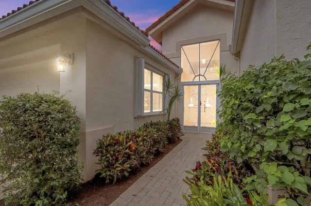 a view of a house with a flower garden
