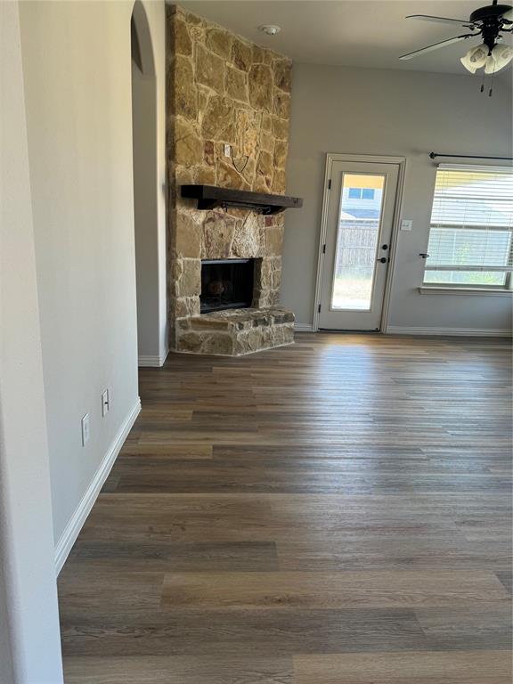 236 Archer Way Forney, TX 75126 - Photo 5 of 35 a view of an empty room with wooden floor fireplace and a window