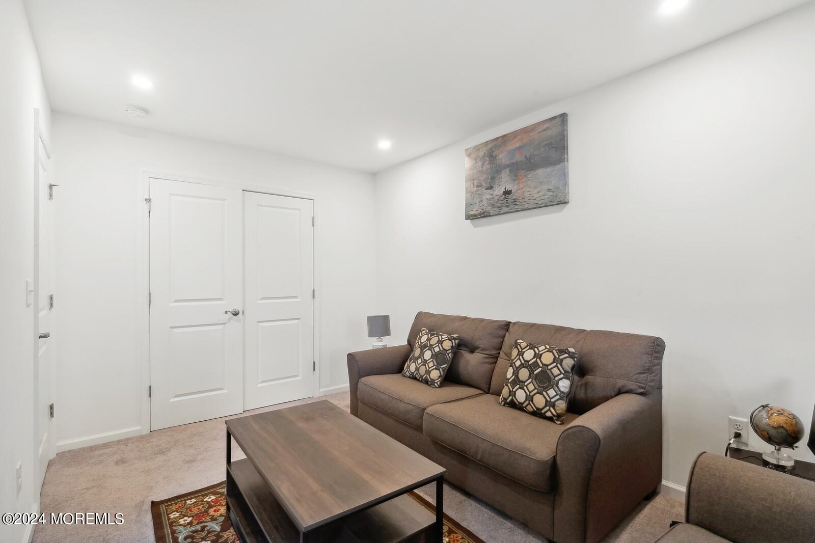 309 Revival Road Brick, NJ 08723 - Photo 11 of 37 a living room with furniture and a couch