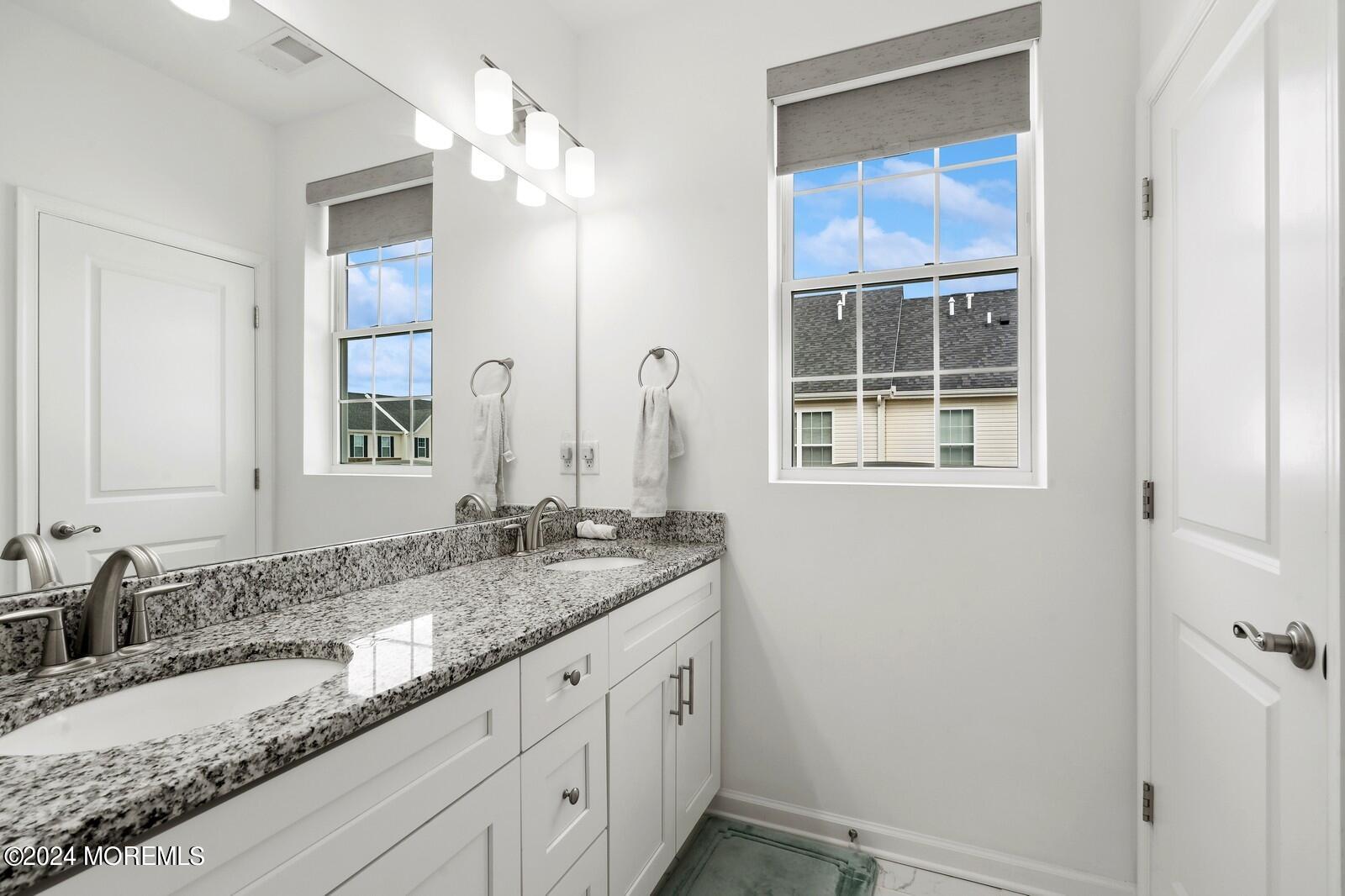 309 Revival Road Brick, NJ 08723 - Photo 17 of 37 a bathroom with a granite countertop sink mirror and double