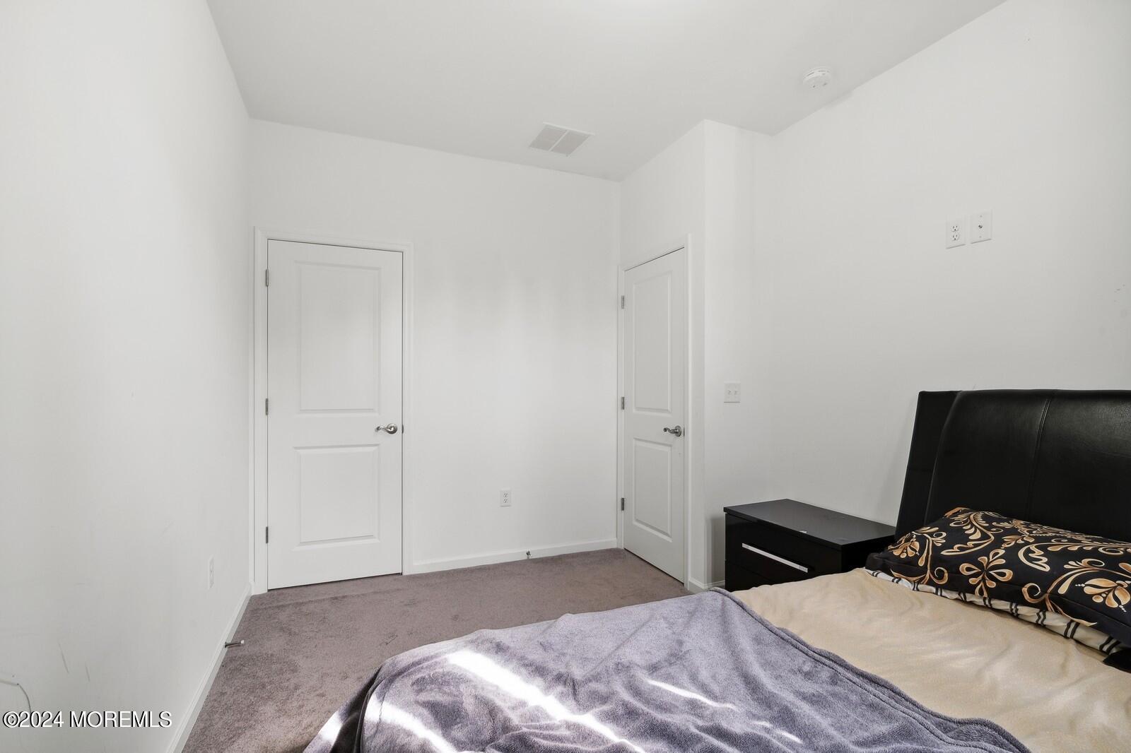 309 Revival Road Brick, NJ 08723 - Photo 19 of 37 a bedroom with a bed and a television