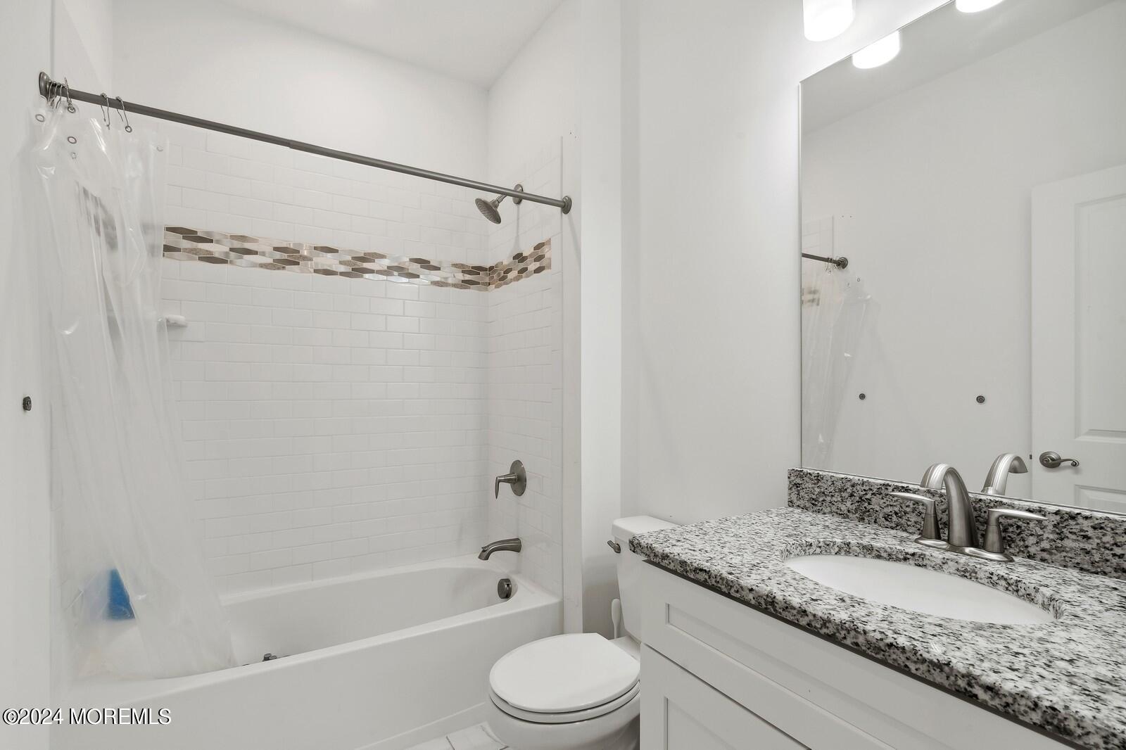 309 Revival Road Brick, NJ 08723 - Photo 20 of 37 a bathroom with a granite countertop sink toilet and shower